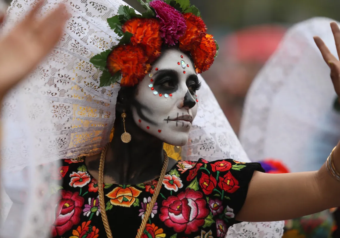 Participants in costume perform during the annual International Day of the Dead Parade in Mexico City, Mexico on October 27, 2019. Thousands of people from Mexico City took to the streets to enjoy the Day of the Dead parade in which hundreds of artists participated.(Getty)
