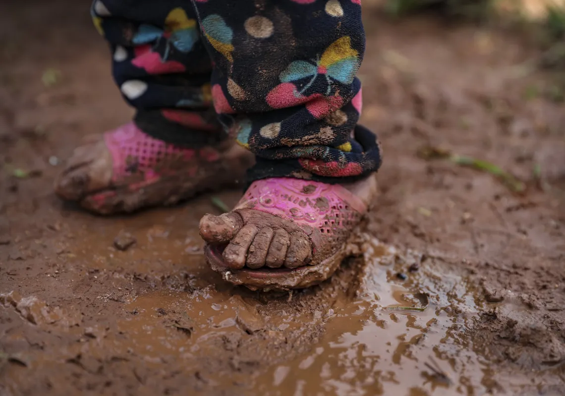 A Syrian kid stands in mud near the tents at 90 tents capacity of Little Fida Camp hosting Syrian families who have been forced to displace due to the attacks carried out by Assad regime and Russia, trying to live under harsh winter conditions in Idlib, Syria on January 07, 2020. (Getty) 