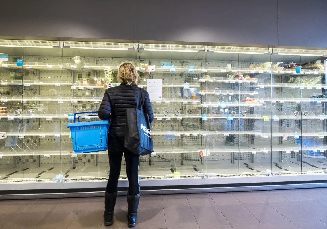 Shoppers are confronted with empty shelves at a supermarket that was raided by hoarders scared by the corona virus on March 14, 2020 in Wassenaar, The Netherlands. (Getty)
