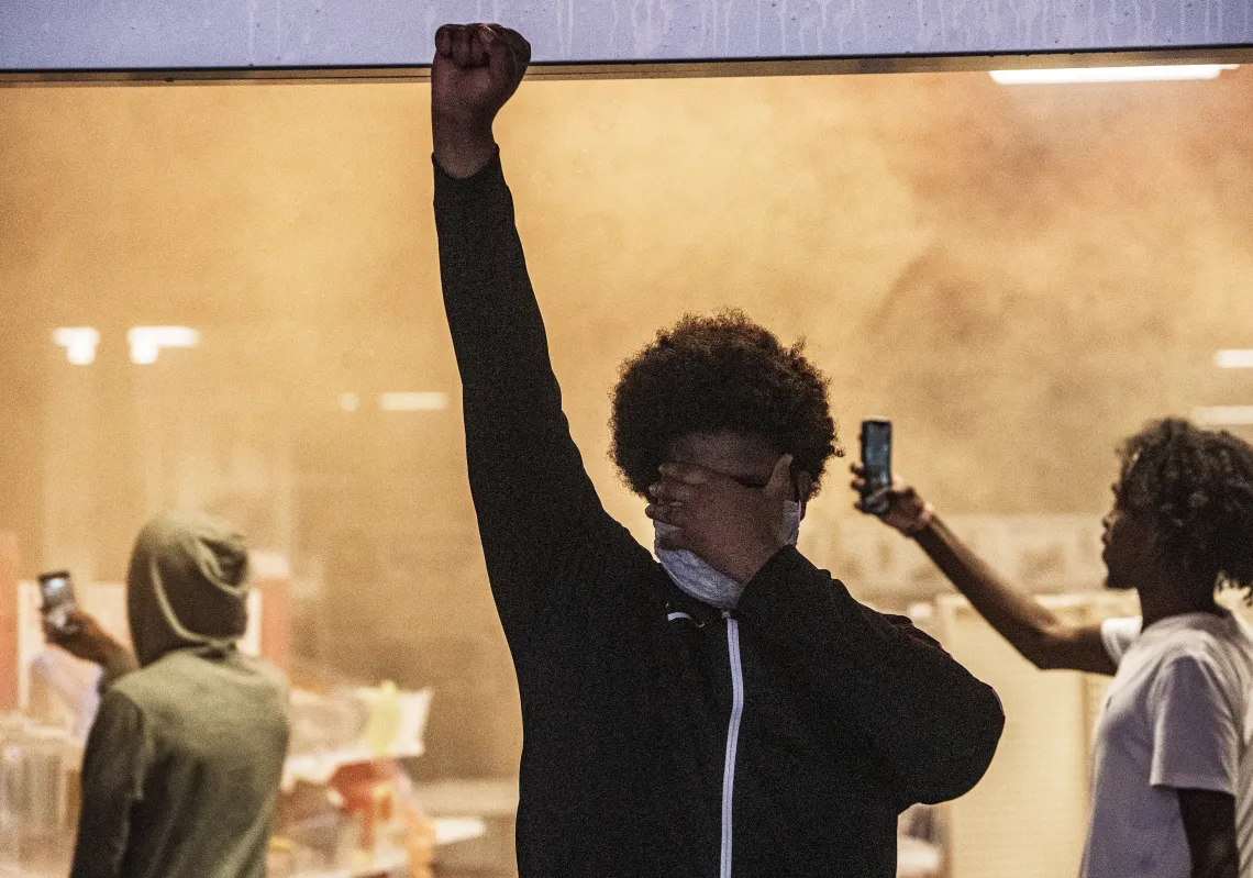 fire broke out in an auto parts store across from the Minneapolis police's Third Precinct station Wednesday amid a second night of protest. (Getty)