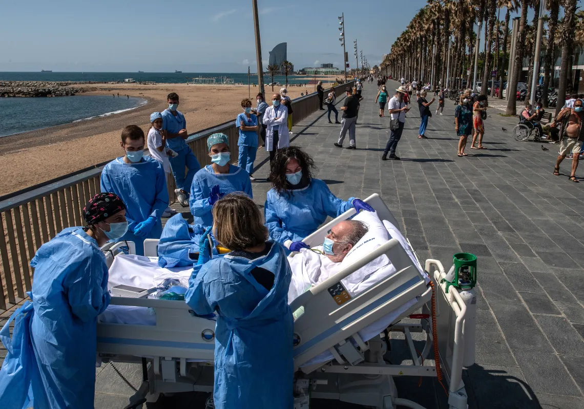 Hospital patient Isidre Correa is taken to the seaside by intensive health care staff outside the Hospital del Mar on June 03, 2020 in Barcelona, Spain. (Getty)