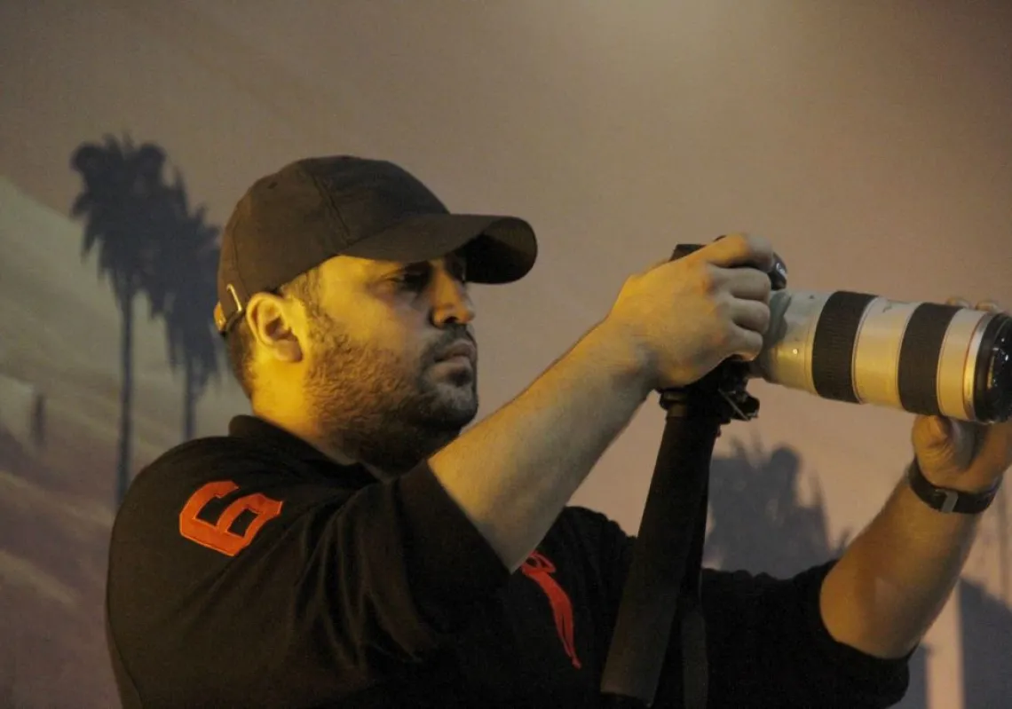 A picture taken on November 3, 2014 shows Jawad Nasrallah, the second eldest son of Hezbollah leader Sheikh Hassan Nasrallah adjusting his camera during a speech by his father, in the southern suburbs of Beirut. (Getty Images)