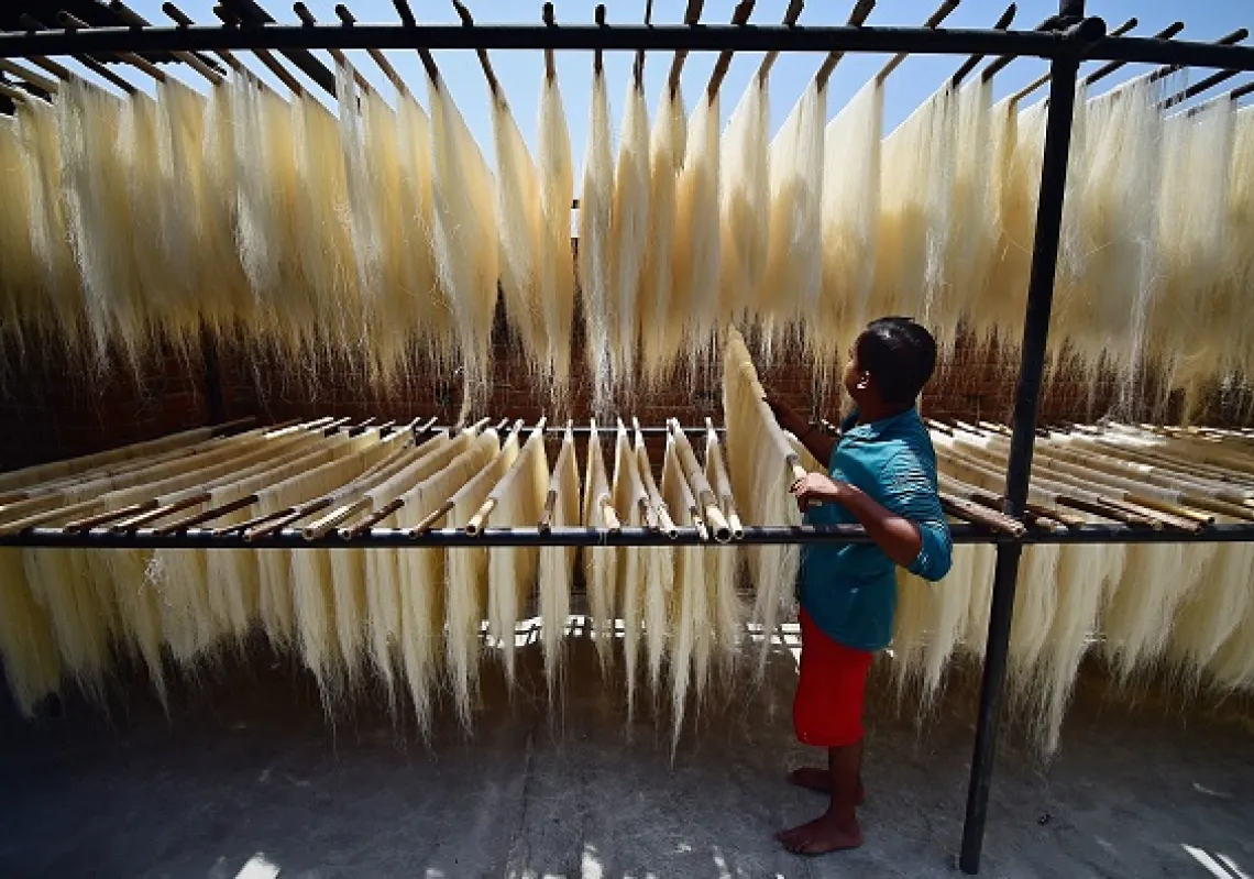  Workers prepare vermicelli which is used in a traditional sweet dish popularly consumed during the holy month of Ramadan at a factory in Allahabad.(Getty)