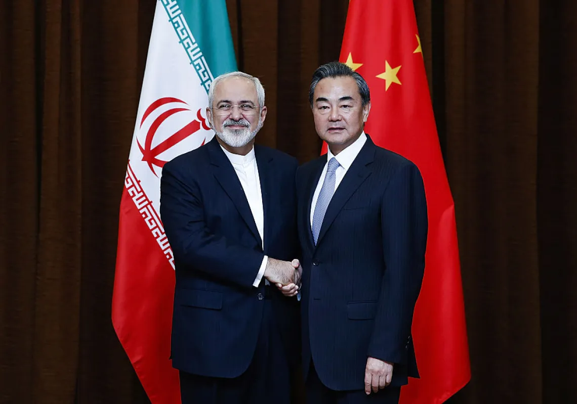 China's Foreign Minister Wang Yi (R) shakes hands with Iranian Foreign Minister Javad Zarif before a bilateral meeting on September 15, 2015 in Beijing, China. (Getty)