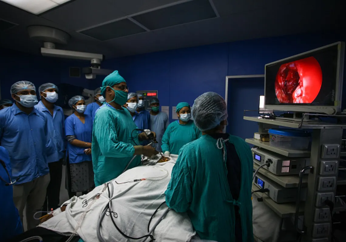 Ear, nose and throat (ENT) specialist Dr. Sachin Jain (3rd from R) performs surgery to remove mucormycosis from a patient who recovered from Covid-19 at Swaroop Rani hospital on June 05, 2021 in Allahabad, India. (Getty)