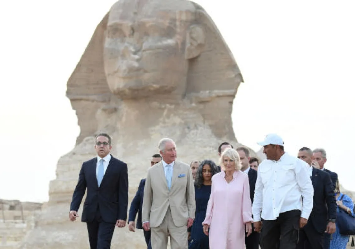 Britain's Prince Charles and Camilla, Duchess of Cornwall, are pictured during a visit to the Giza Pyramids plateau on the western outskirts of the Egyptian capital Cairo on November 18, 2021. (Photo by Ahmed HASAN / AFP)