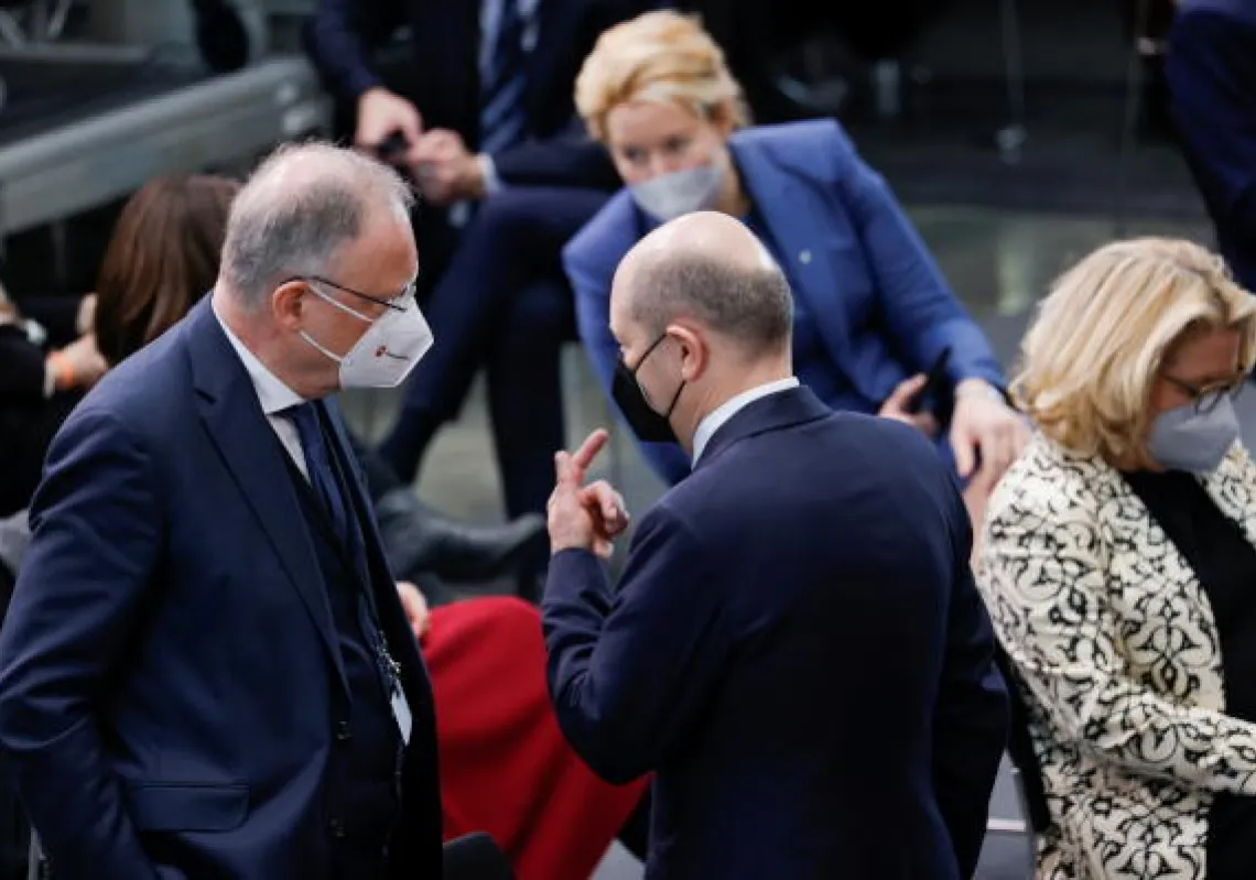 German Chancellor Olaf Scholz talks with Lower Saxony's State Premier Stephan Weil at the Bundestag building Paul Loebe Haus, as the Federal Assembly gathers to elect the new German state president, in Berlin, Germany February 13, 2022. REUTERS/Michele Tantussi/Pool