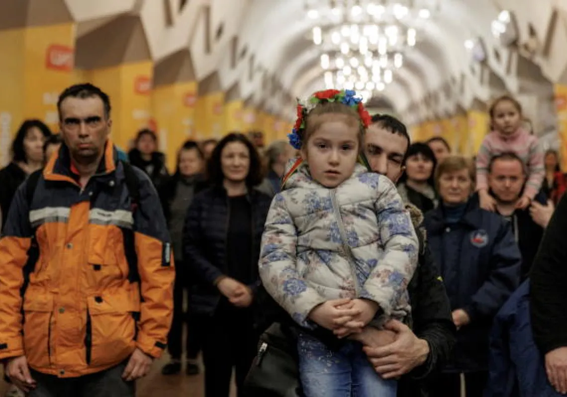  People listen to classical music performed by local musicians in a metro station that serves as a bomb shelter in Kharkiv as Russia's attack on Ukraine continues, Ukraine, March 26, 2022. REUTERS/Thomas Peter 