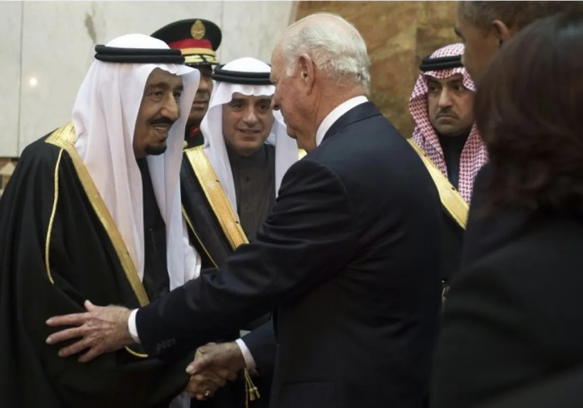 Saudi's newly appointed King Salman (L) shakes hands with former US secretary of state James Baker (C) at Erga Palace in Riyadh on January 27, 2015. (Photo by SAUL LOEB/AFP/Getty Images)