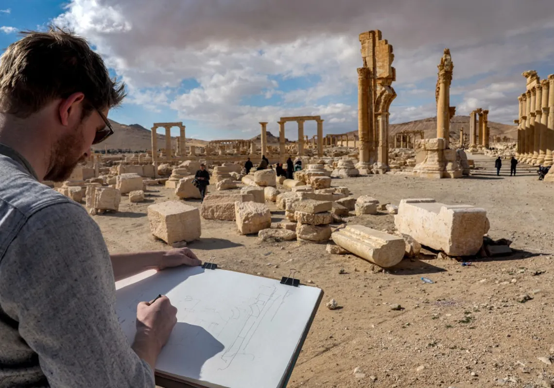 A visitor makes sketches at Palmyra. During their occupation of the site from 2015, Islamic State (IS) jihadists reduced several temples, columns, and other treasures to heaps of stone.