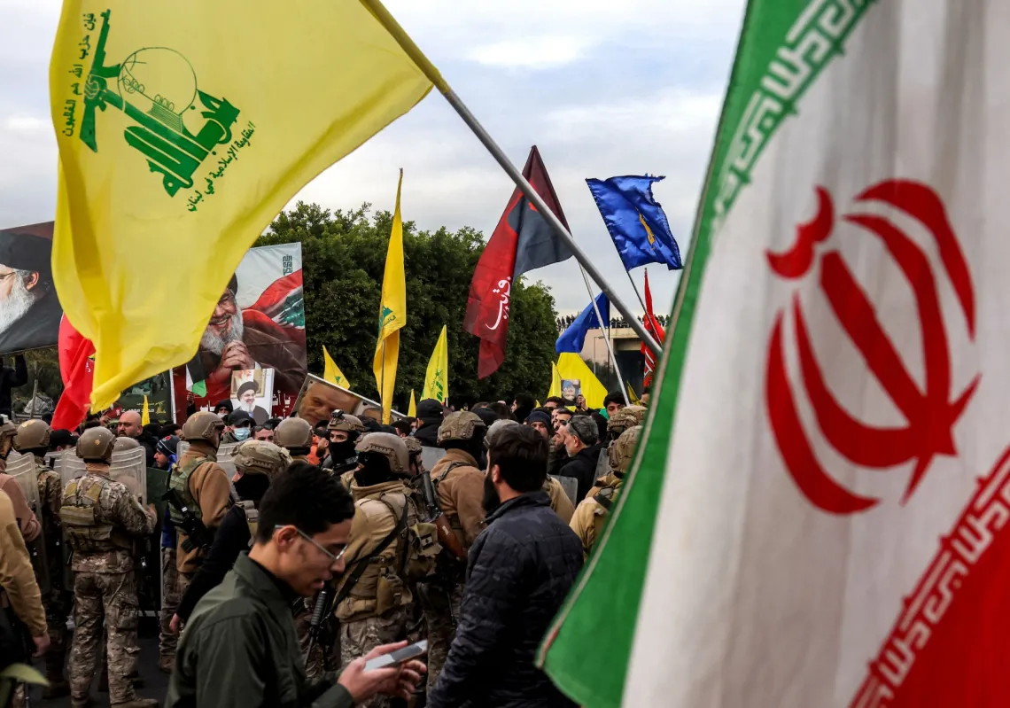 Protesters wave Iranian and Hezbollah flags during a rally at Beirut airport on February 15, 2025. Iran&#039;s strategy of using militias is now in tatters.