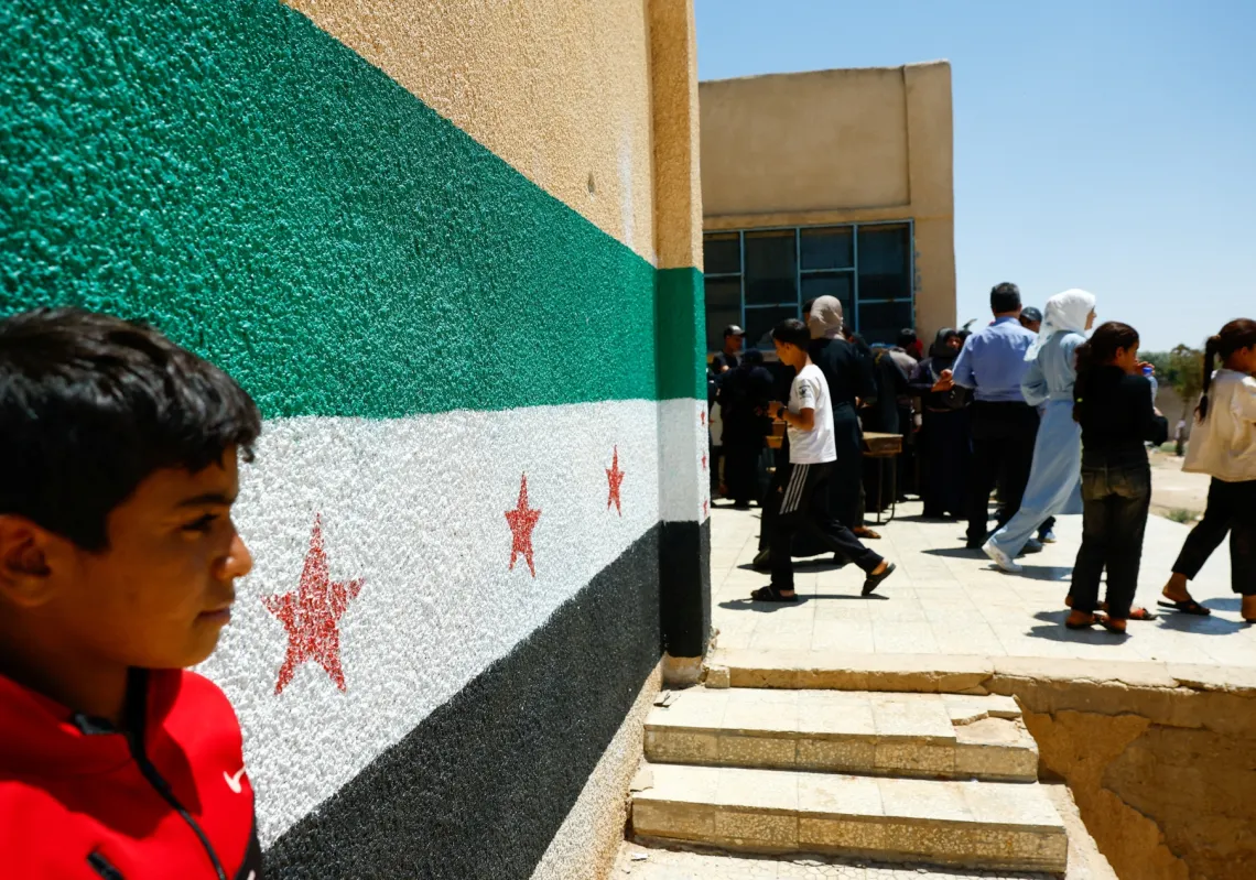 Bedouin families who left Suweida take a shelter at a school in the village of El Sahoah in Deraa Governorate, Syria, July 28, 2025.
