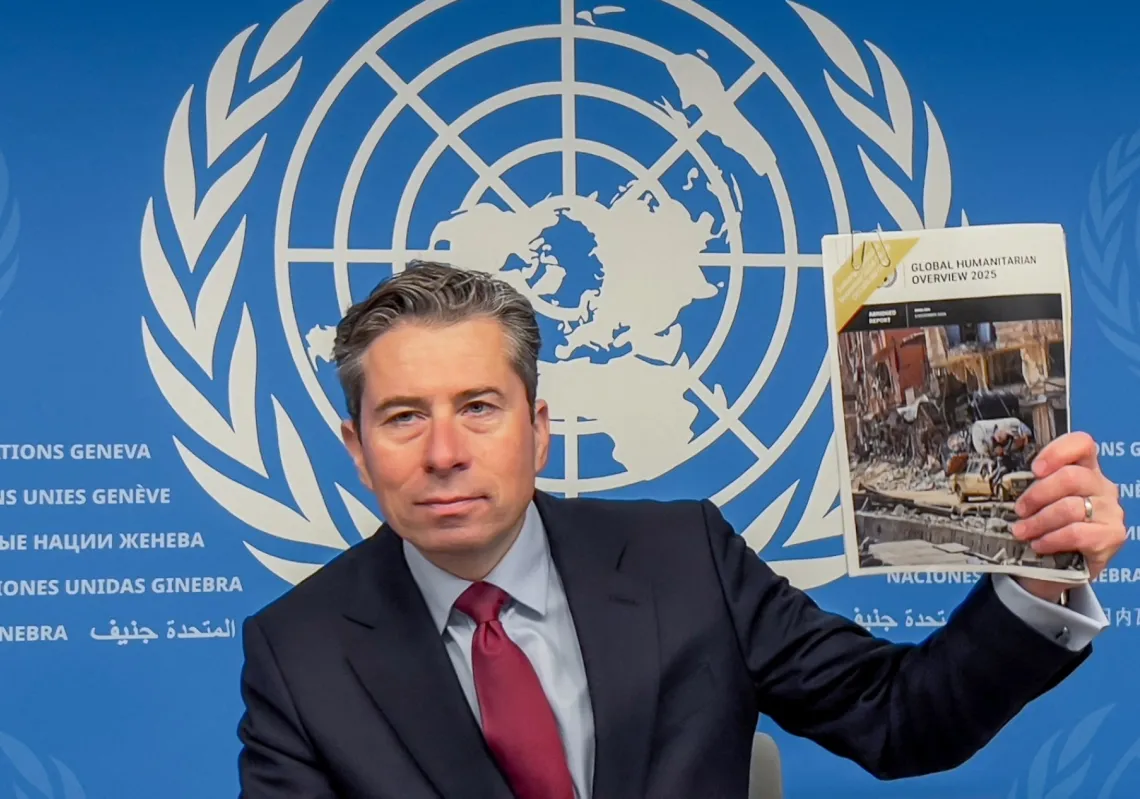 UN Humanitarian Affairs and Emergency Relief Coordinator (OCHA) Under-Secretary-General Tom Fletcher holds the
Global Humanitarian Overview 2025 report during a press conference in Geneva on December 3, 2024.