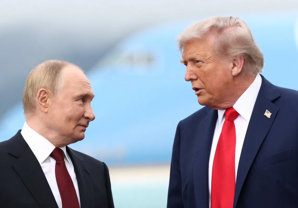 US President Donald Trump speaks with Russian President Vladimir Putin, as they meet to negotiate for an end to the war in Ukraine, at Joint Base Elmendorf-Richardson in Anchorage, Alaska, US, August 15, 2025. 