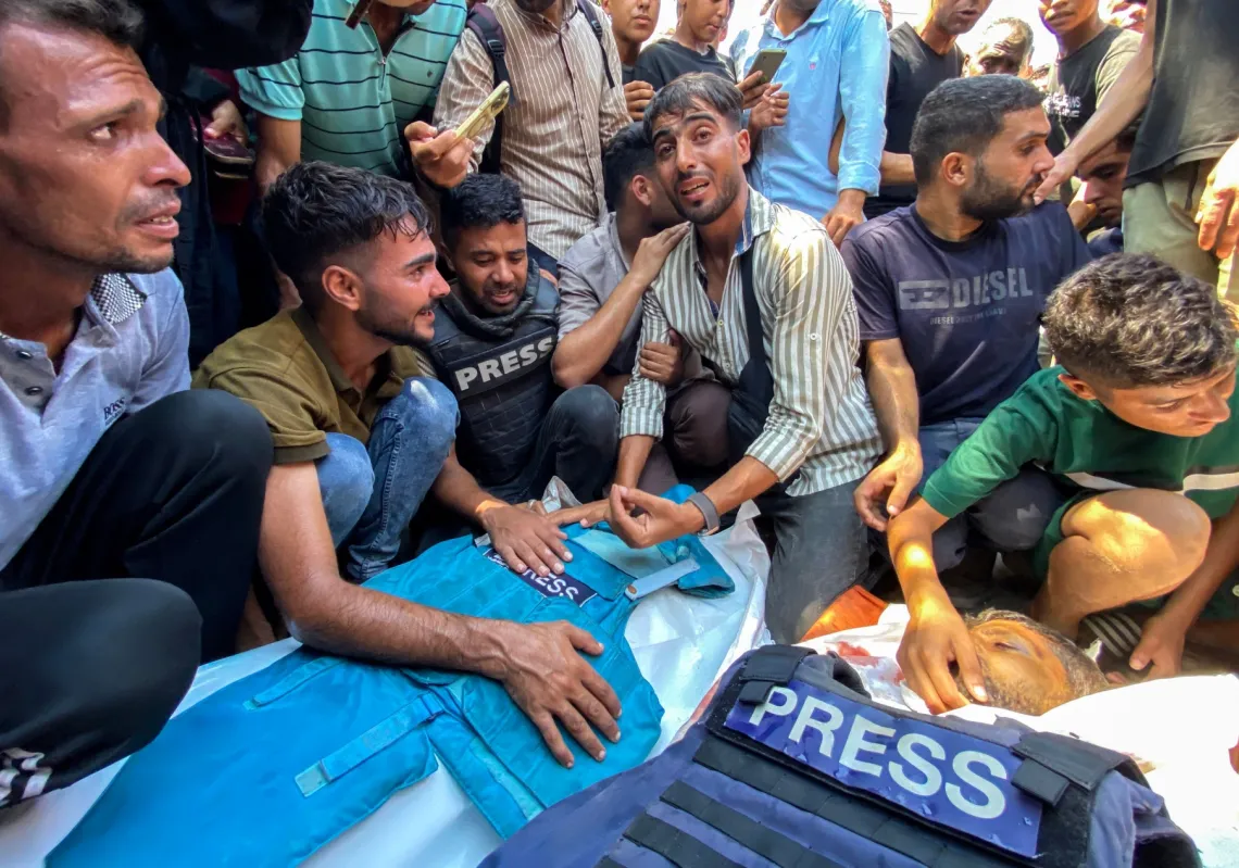 People mourn for Palestinian journalists Moaz Abu Taha and Hussam al-Masri, a Reuters contractor, who were killed in an Israeli strike on Nasser hospital in Khan Yunis in Gaza on August 25, 2025, along with 15 others.