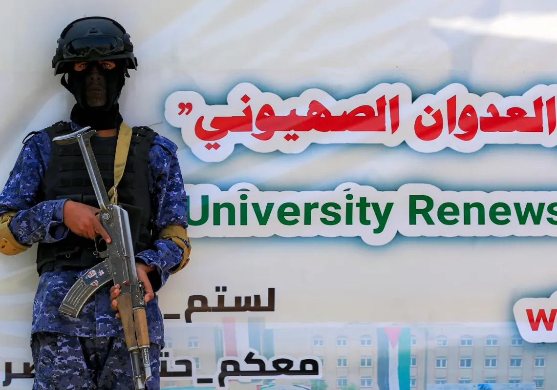 A Houthi security soldier stands guard at a student-led protest condemning Israel's genocide in Gaza at Sanaa University on August 27, 2025.