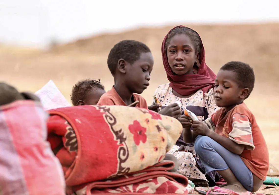 Displaced Sudanese children gather at a camp near the town of Tawila in North Darfur on February 11, 2025, amid the ongoing war between the army and paramilitary forces.