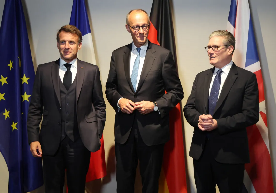 France's President Emmanuel Macron (L), Germany’s Chancellor Friedrich Merz and Britain's Prime Minister Keir Starmer meet on the sidelines of the two-day NATO Heads of State and Government summit in The Hague on June 24, 2025. 