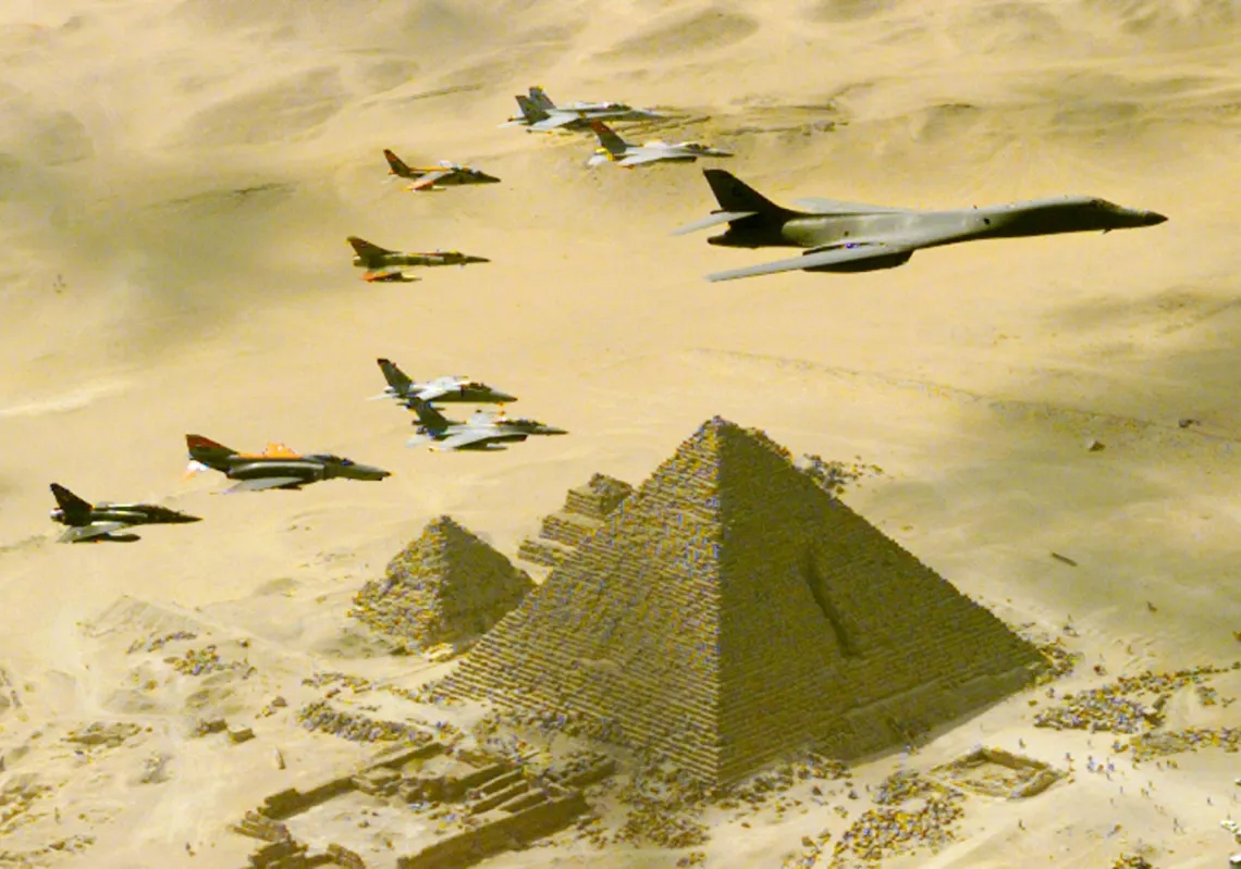 A US Air Force B-1B bomber is followed by fighter planes above one of the three Great Pyramids of Giza, Egypt, on October 25, during a demonstration flight as part of the Bright Star 99 military exercises. 