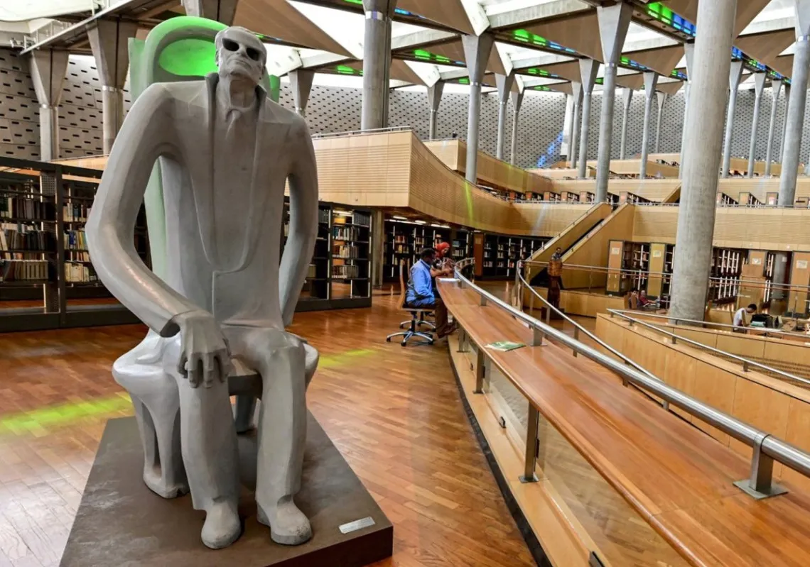 A photo taken on June 24, 2019, shows a huge statue of the late Egyptian writer Taha Hussein inside the Bibliotheca Alexandrina building.