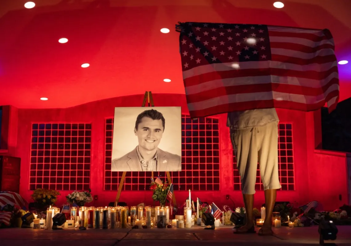 People pay their respects during a candlelight vigil for youth activist and influencer Charlie Kirk at a makeshift memorial at Orem City Centre Park in Orem, Utah, on September 11, 2025, a day after he was shot dead.
