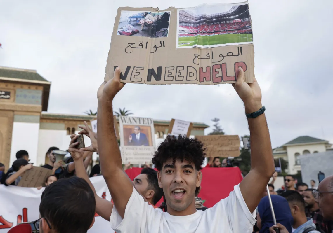 Demonstrators lift placards during a youth-led protest demanding reforms to public healthcare and education at Mohamed V square in Casablanca on October 6, 2025.
