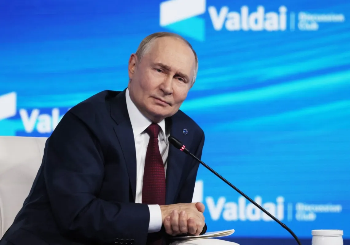 In this pool photograph distributed by the Russian state agency Sputnik, Russia's President Vladimir Putin attends the Valdai Discussion Club meeting in Sochi on October 2, 2025.