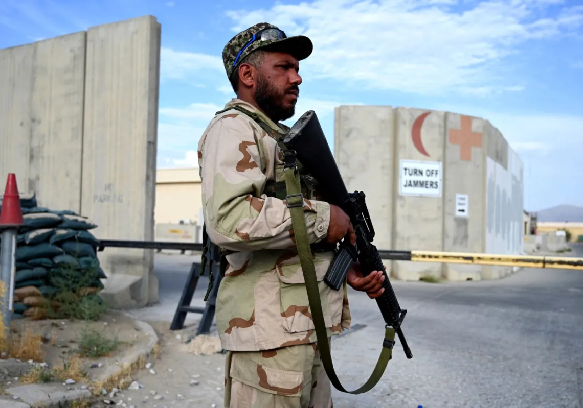 An Afghan National Army (ANA) soldier stands guard at a gate of a hospital inside the Bagram US air base after all US and NATO troops left, some 70 Km north of Kabul on July 5, 2021. 