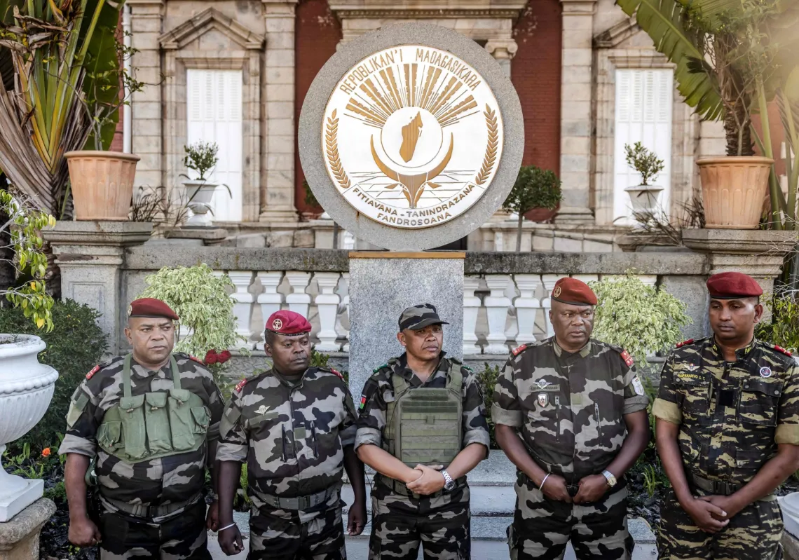 Malagasy Colonel Michael Randrianirina, head of the CAPSAT military unit, reads out a statement in front of the presidential palace, where he announces the army is taking power in Antananarivo on October 14, 2025.