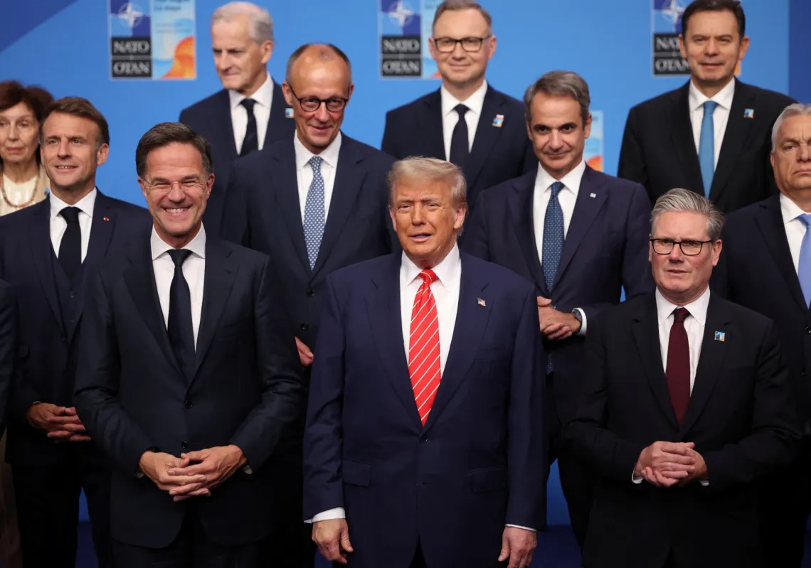 US President Donald Trump stands next to NATO Secretary General Mark Rutte and British Prime Minister Keir Starmer as NATO leaders pose for a group photo at a NATO summit in The Hague, Netherlands, on June 25, 2025.