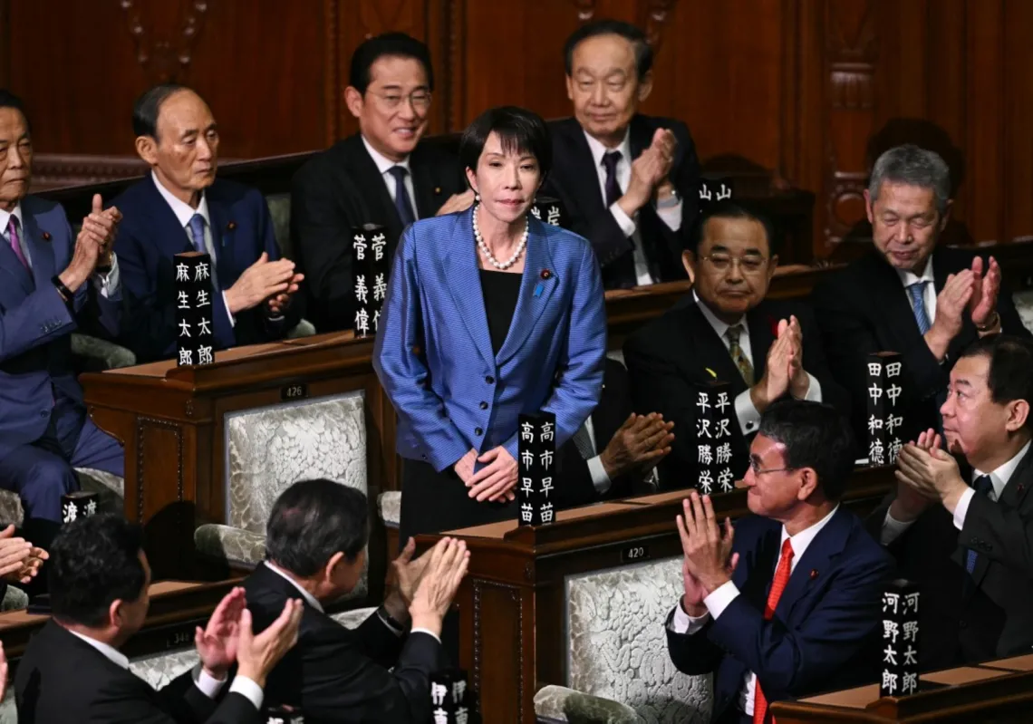LDP President Sanae Takaichi receives applause after she was selected as Japan's new prime minister during an extraordinary session of the lower house of parliament in Tokyo on October 21, 2025.