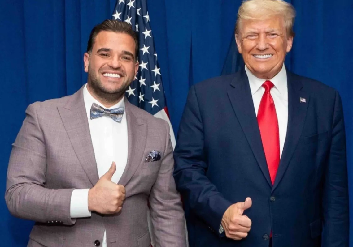 Donald Trump poses with his new special envoy to Iraq Mark Savaya