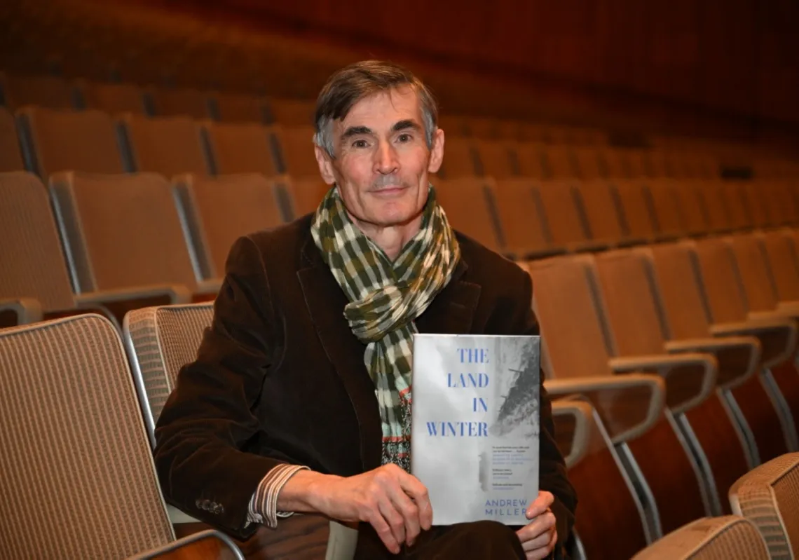 British author Andrew Millar holds his novel &quot;The Land in Winter&quot; during a photoshoot for the 2025 Booker Prize shortlist.