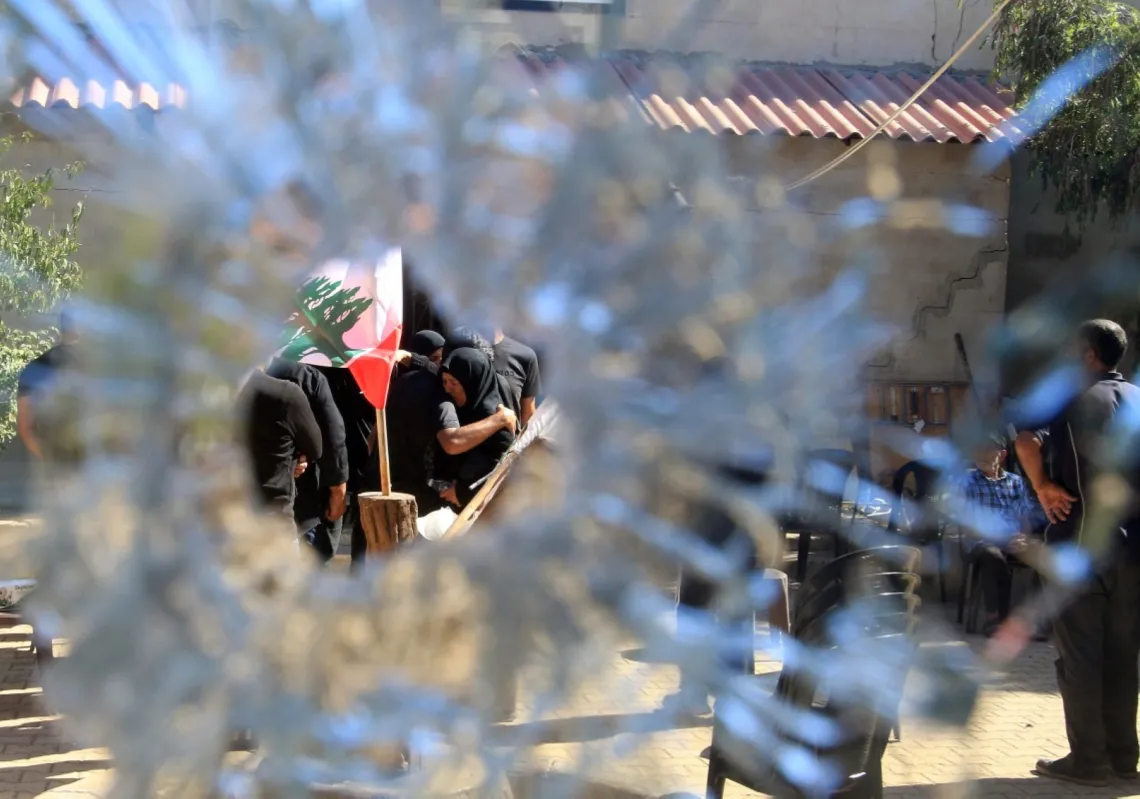 People gather outside the municipality building in the southern Lebanese border village of Blida in the aftermath of an Israeli army raid on the village, on 30 October 2025.