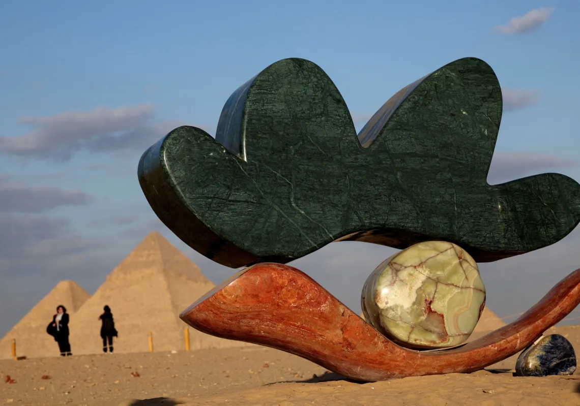 The project 'Echoes Of The Infinite' by Alex Proba and Solidnature is displayed at an art exhibition in front of the Great Pyramids of Giza, in Cairo, Egypt, on 15 November 2025. 