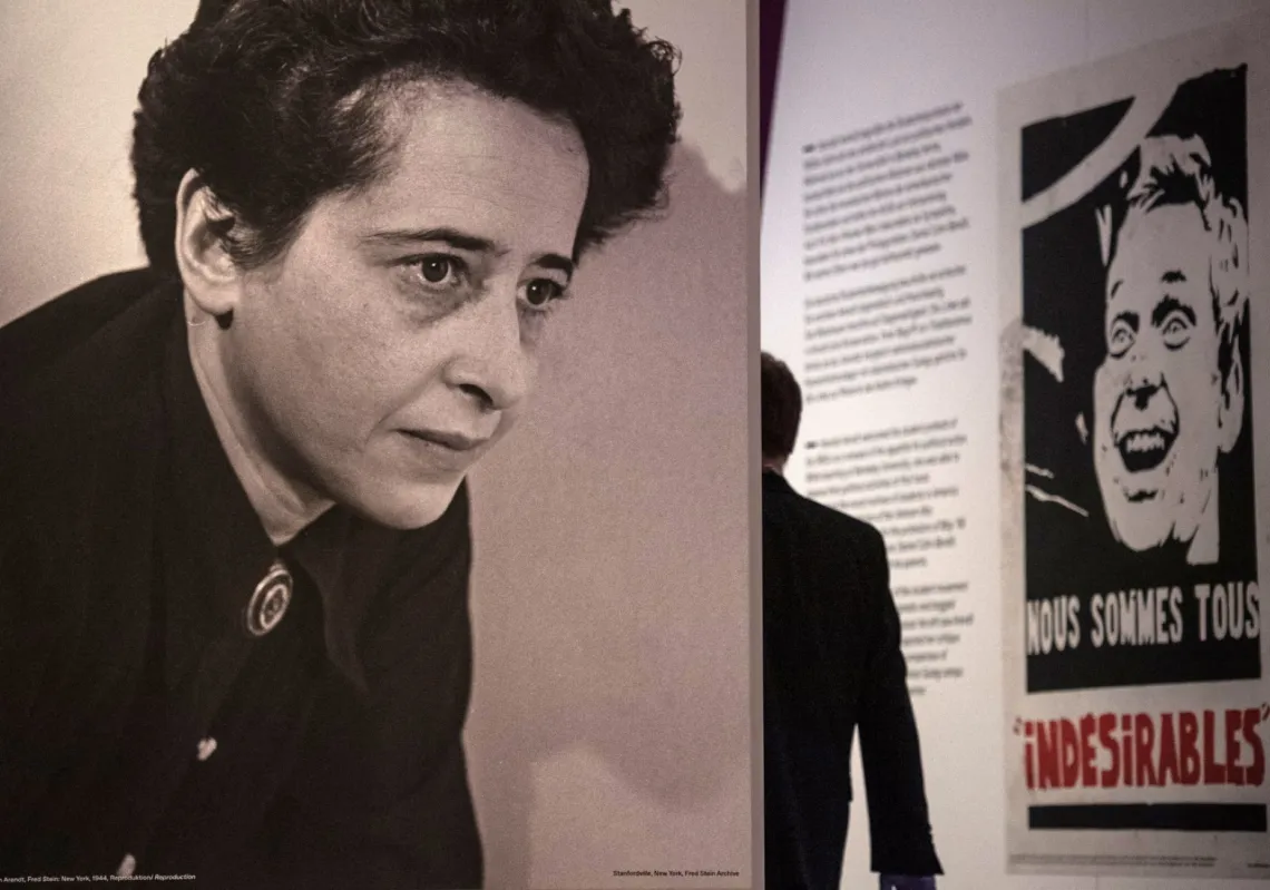 A visitor stands next to a photograph of German-American philosopher Hannah Arendt at the German Historical Museum in Berlin on 6 May 2020. 