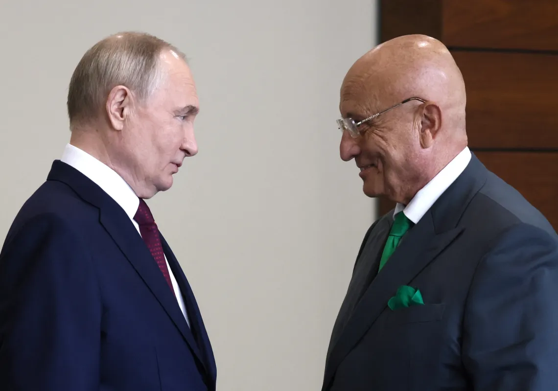 Russian President Vladimir Putin speaks to Prof. Sergei Karaganov before a plenary session of the St. Petersburg International Economic Forum on 7 June 2024.