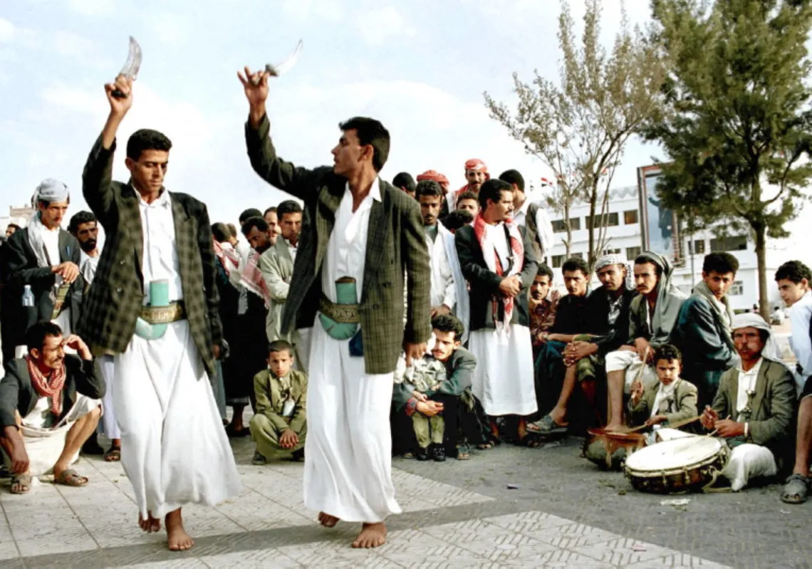 Yemeni men celebrate their country's 10th anniversary of unity by dancing 19 May 2000 in Tahrir Square in the heart of Sana'a. 