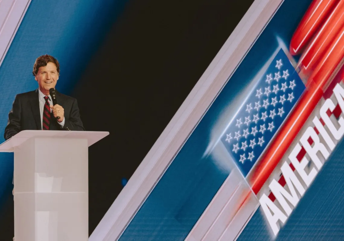 Conservative political commentator and podcast host Tucker Carlson speaks at Turning Point's annual AmericaFest conference, in remembrance of late right-wing political activist Charlie Kirk, in Phoenix, Arizona, on 18 December 2025.