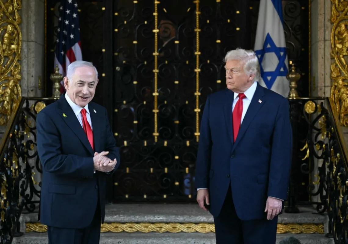 US President Donald Trump (R) and Israeli Prime Minister Benjamin Netanyahu (L) speak to reporters upon Netanyahu's arrival at Trump’s Mar-a-Lago residence in Palm Beach, Florida, on 29 December 2025.