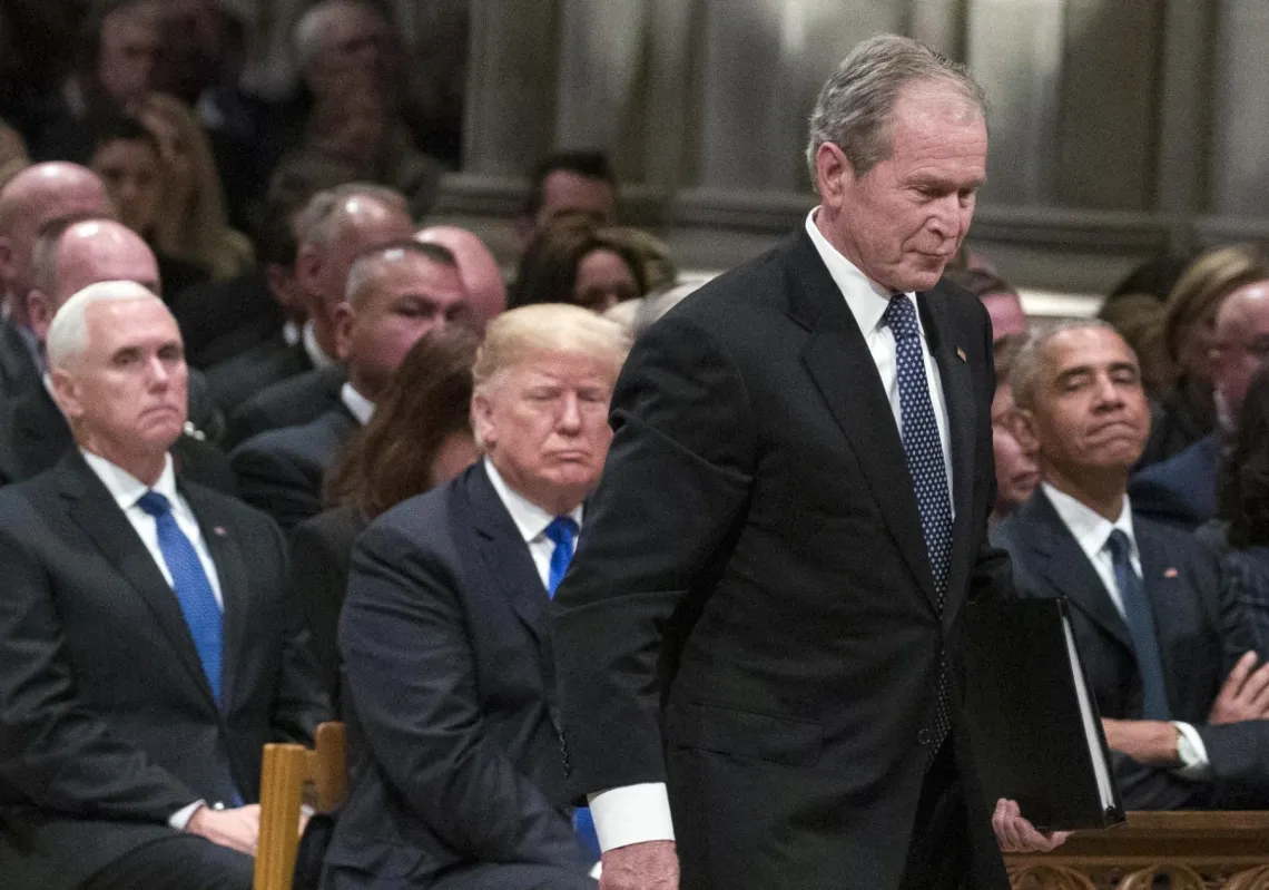 Former President George W. Bush walks past President Donald Trump during the state funeral for President George H.W. Bush, at the National Cathedral, on 5 December 2018, in Washington, DC.