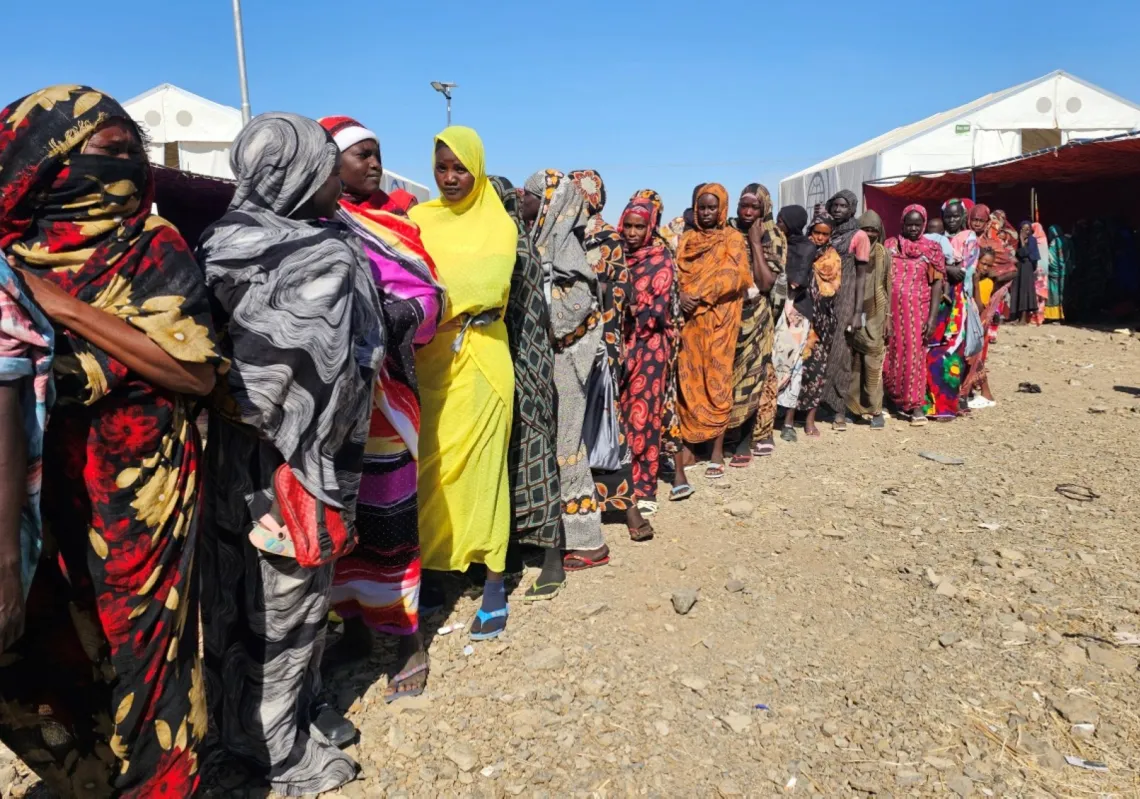 Sudanese displaced from the Heglig area in western Sudan wait to receive humanitarian aid at the Abu al-Naga displacement Camp in the in Gedaref State, some 420km east of the capital Khartoum on 30 December 2025.