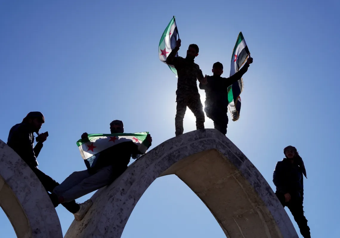Syrians celebrate in Raqqa on 19 January 2026, after Syria and the SDF struck a wide-ranging deal to bring Kurdish civilian and military authorities under central government control on Sunday.