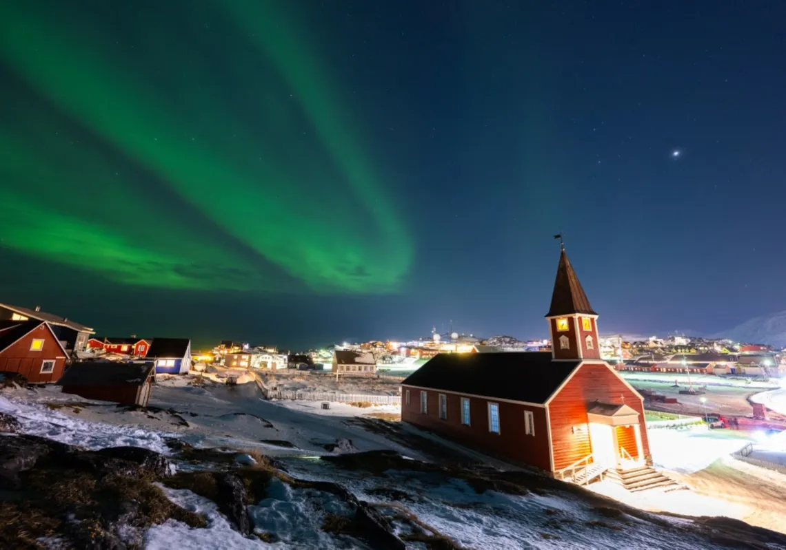 The aurora borealis lights up the sky above the Nuuk cathedral in Nuuk, Greenland, on 23 January 2026. 