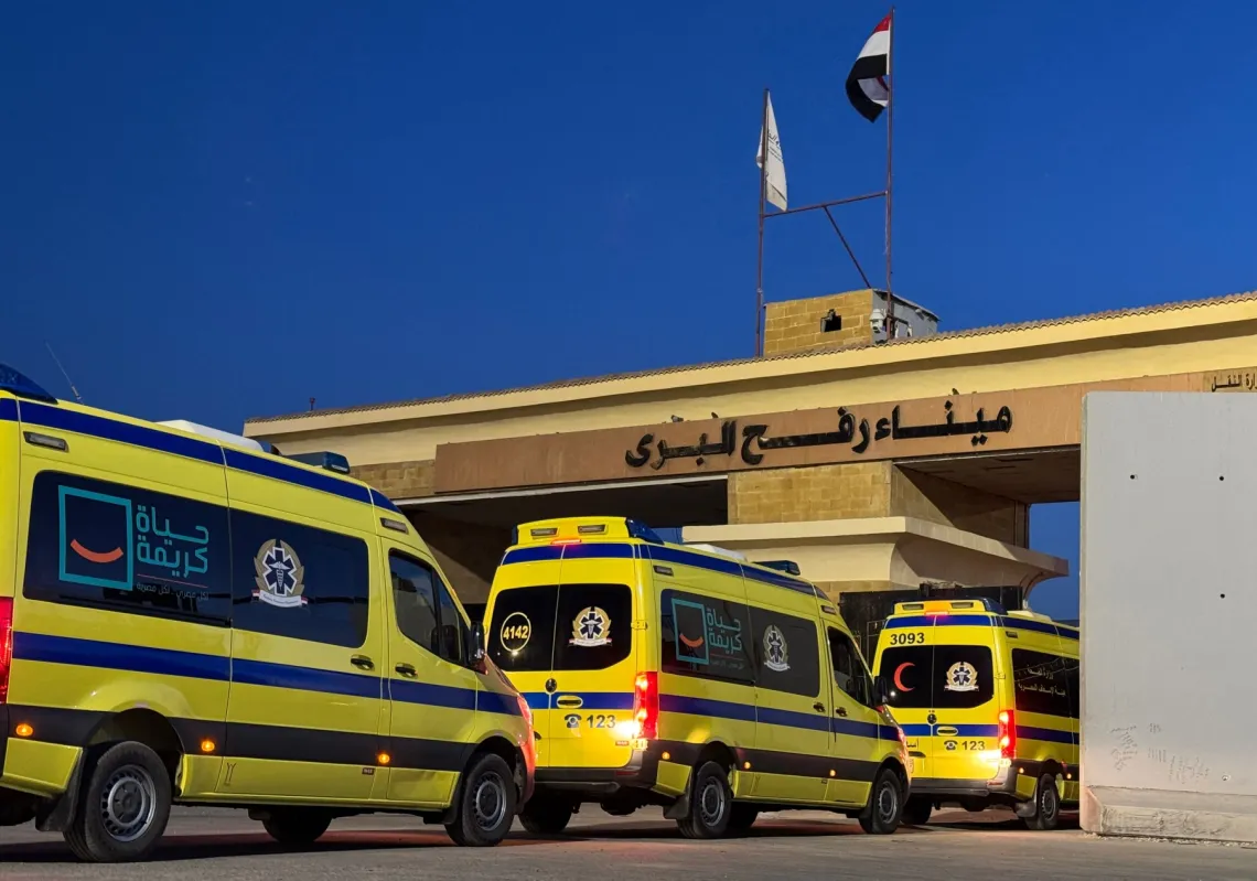 Ambulances wait in line at the Egyptian side of the Rafah border crossing with the Palestinian Gaza Strip, in northeastern Egypt on the first day of the evacuation of some 50 Palestinian, at the Rafah crossing on 2 February 2026.