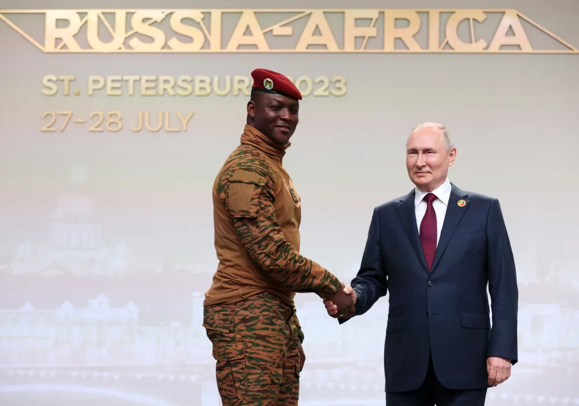 Burkina Faso's Capt. Ibrahim Traore, left, and Russian President Vladimir Putin shake hands before an official ceremony to welcome the leaders of delegations to the Russia Africa Summit in St. Petersburg, Russia, July 27, 2023