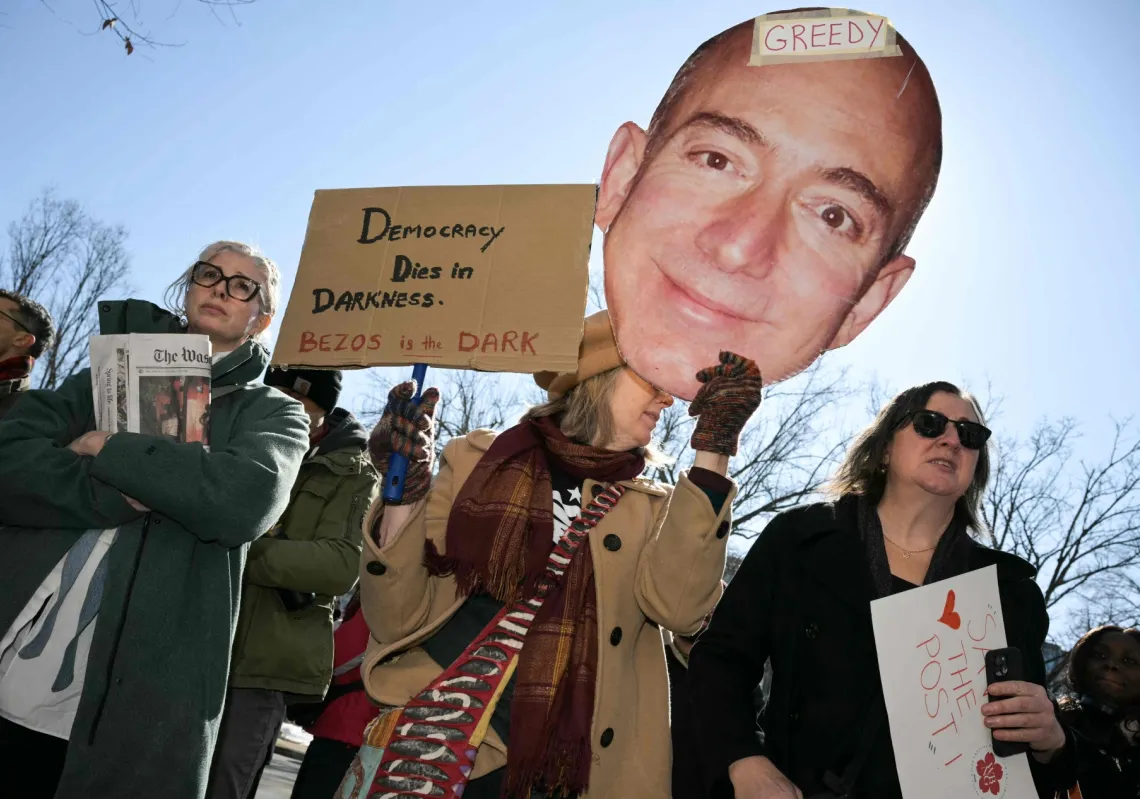 Washington Post employees, along with supporters from the Washington-Baltimore News Guild, rally outside the Washington Post office building in Washington, DC, on 5 February 2026.