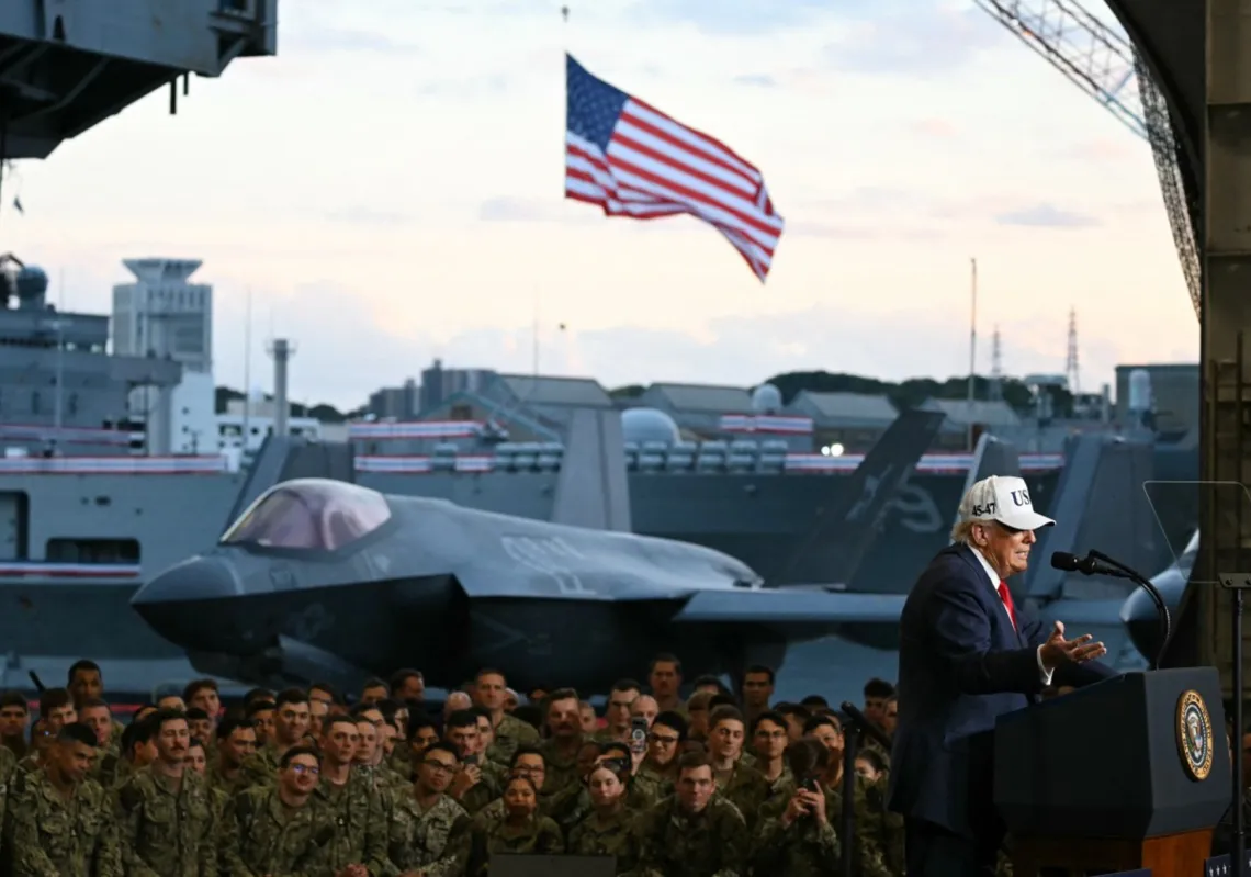 US President Donald Trump addresses members of the Navy aboard the aircraft carrier USS George Washington at Yokosuka Naval Base on 28 October 2025. 
