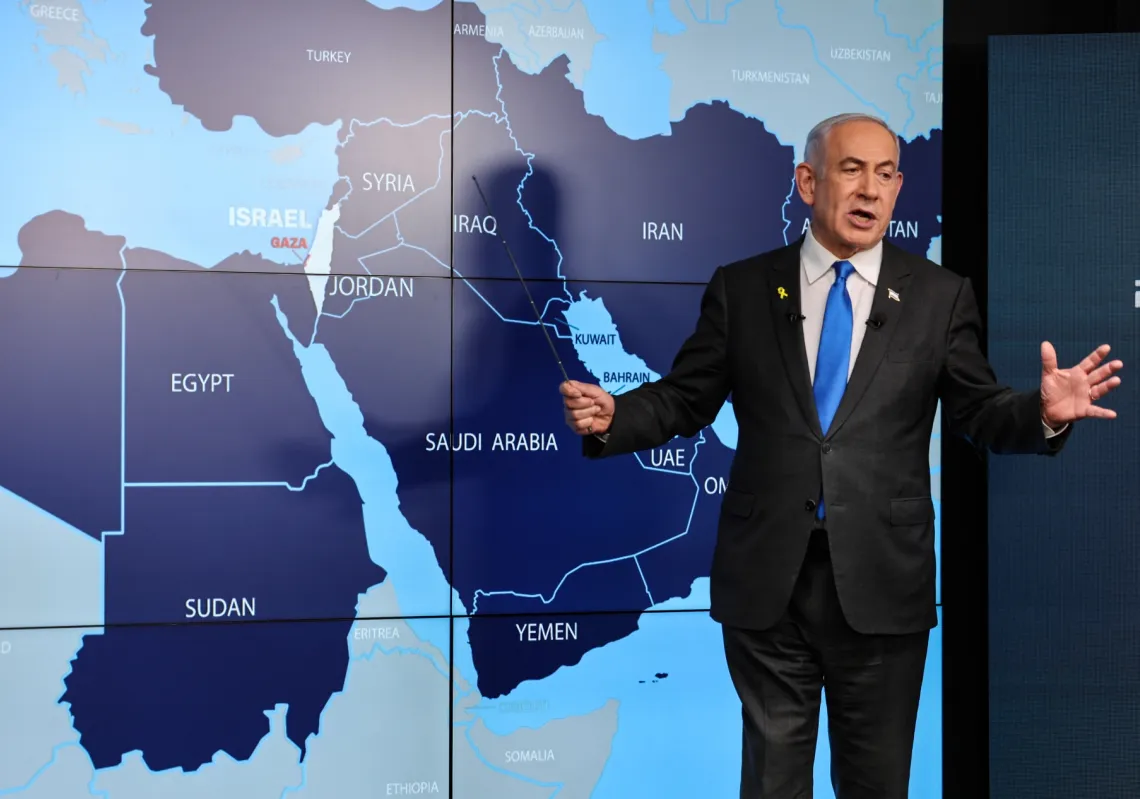 Israel's Prime Minister Benjamin Netanyahu speaks in front of a map of the Middle East during a press conference at the Government Press Office (GPO) on 4 September 2024.