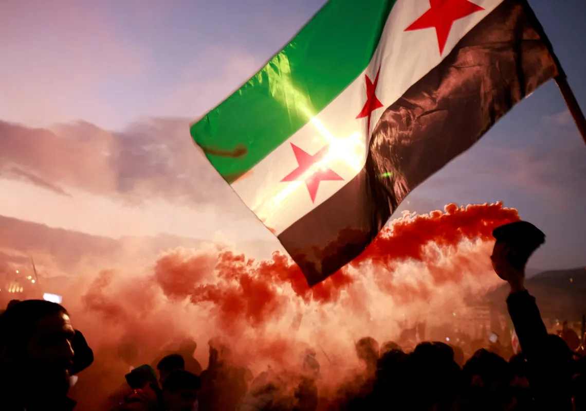 People gather during a celebration called by Hayat Tahrir al-Sham (HTS) at the Umayyad Square, after the ousting of Syria's Bashar al-Assad, in Damascus, Syria, 20 December, 2024.